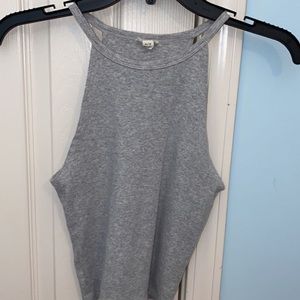 Gray crop top with open sides.